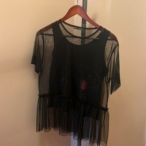 Tank top and sheet over shirt